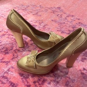 Very lightly worn (twice) pair of gold Cole Haan pumps from Nike Air collection